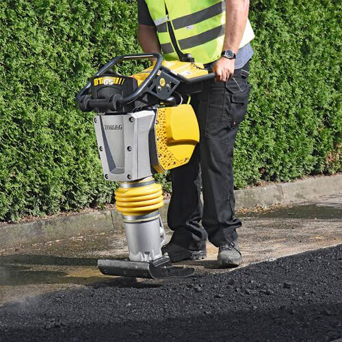 Maxi Equipment Hire image of the Bomag Petrol Leg Rammer in use for leg rammer hire.