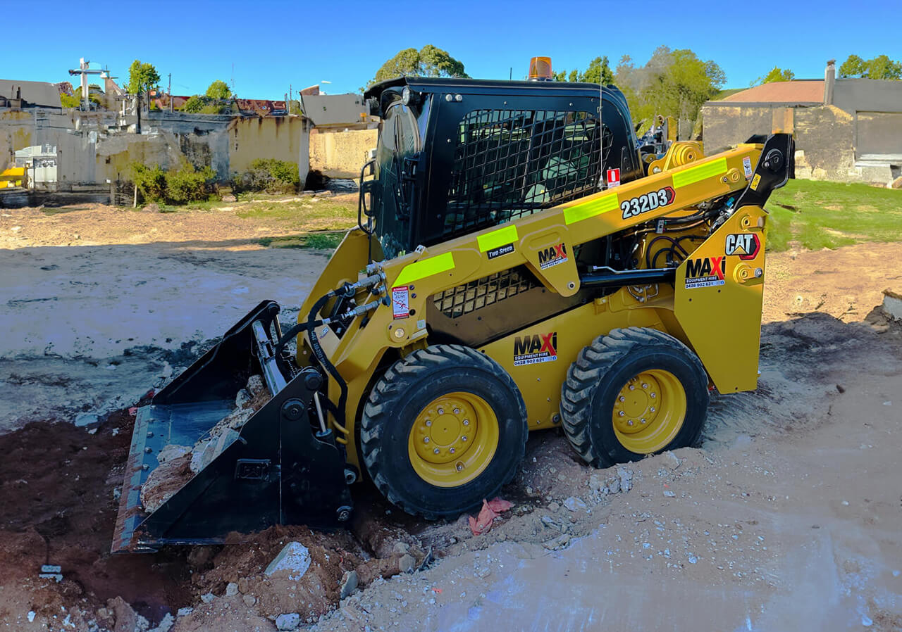 Maxi Equipment Hire photo of Cat 3 Ton Skid Steer conducting earth works.